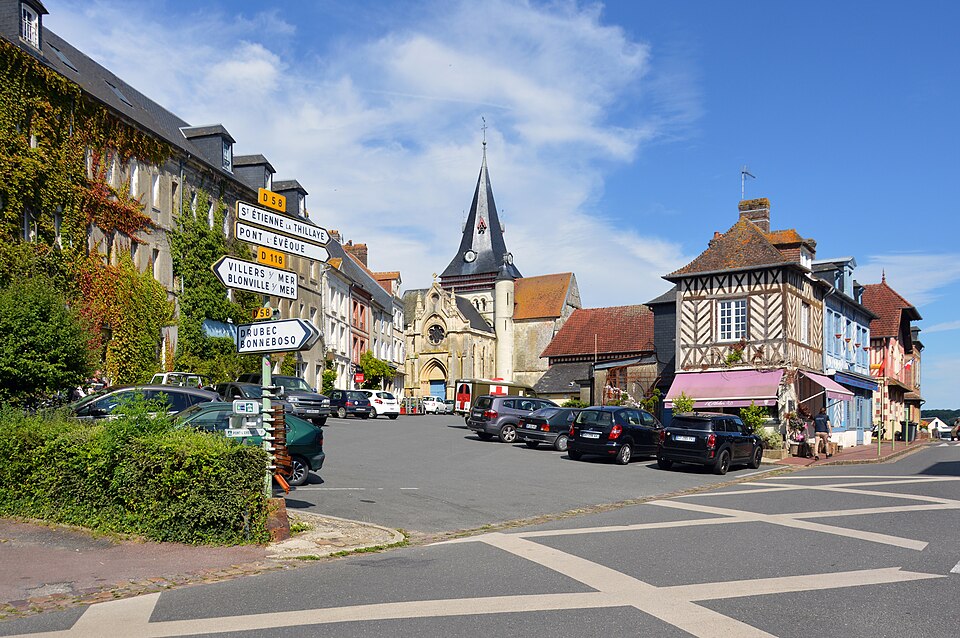 Looking up Place du Colonel Langlois towards the Saint — Sauveur church, Beaumont — en — Auge, 2024